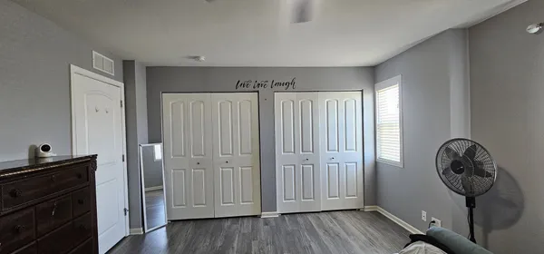a view of a storage & utility room with wooden floor