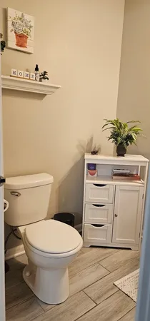 a bathroom with a toilet and a sink