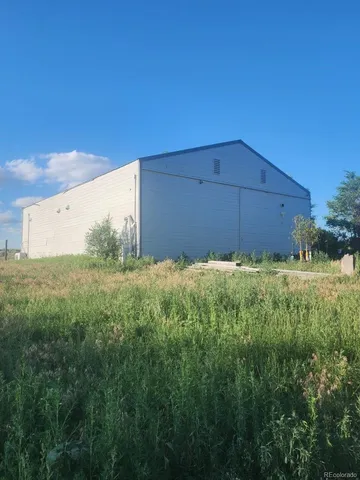 a kitchen with stainless steel appliances granite countertop a stove refrigerator sink and microwave