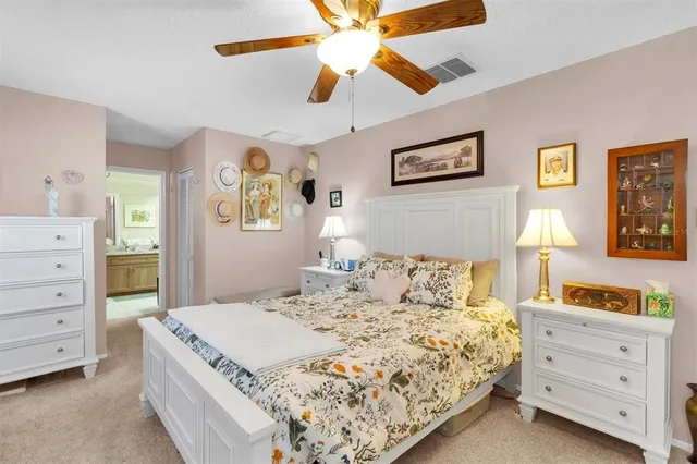 a bedroom with a large bed and a flat screen tv