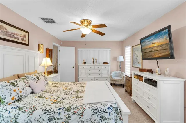 a en suite bathroom with a granite countertop sink and a mirror