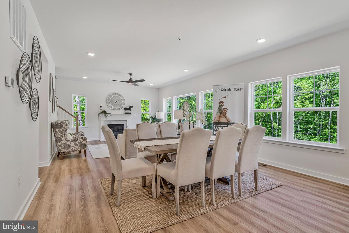 1302 Spruce Street Shady Side, MD 20764 - Photo 12 of 44 a view of a dining room with furniture window and wooden floor