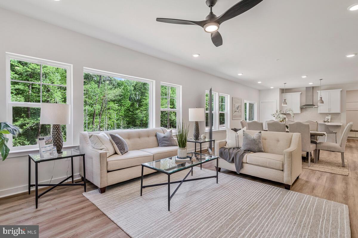 1302 Spruce Street Shady Side, MD 20764 - Photo 13 of 44 a living room with furniture and a large window