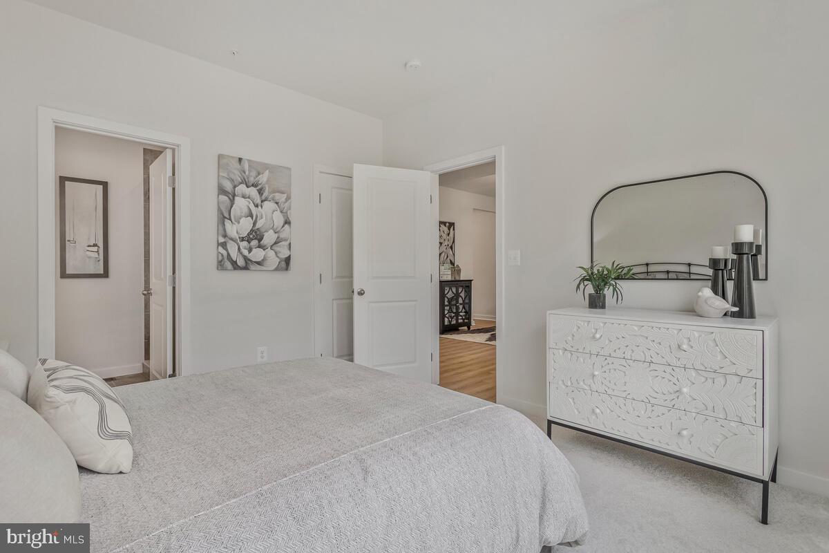 1302 Spruce Street Shady Side, MD 20764 - Photo 22 of 44 a bedroom with a bed and a dresser