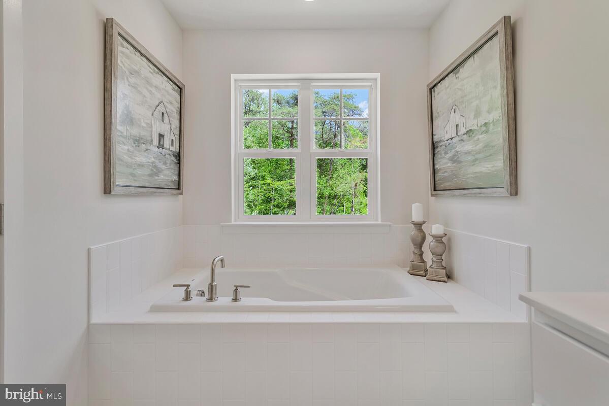 1302 Spruce Street Shady Side, MD 20764 - Photo 30 of 44 a white bath tub sitting next to a white sink