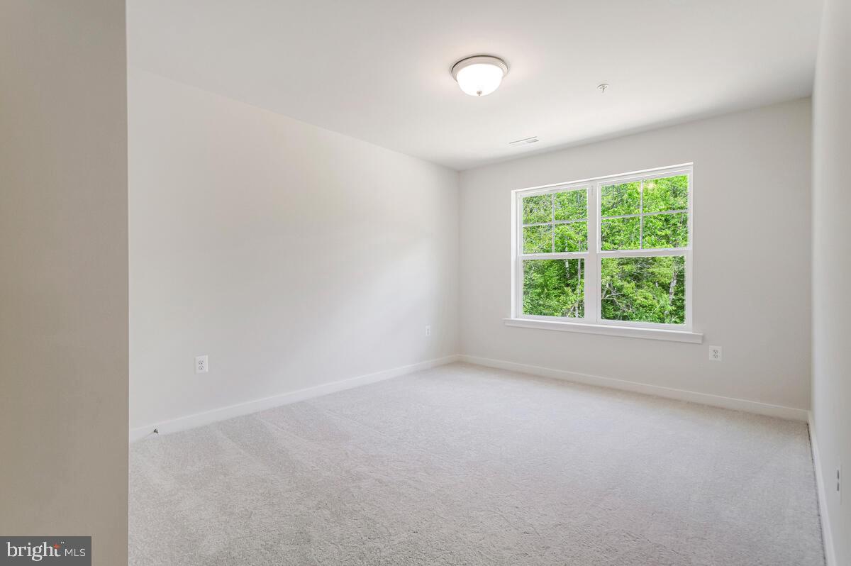 1302 Spruce Street Shady Side, MD 20764 - Photo 30 of 43 an empty room with a window