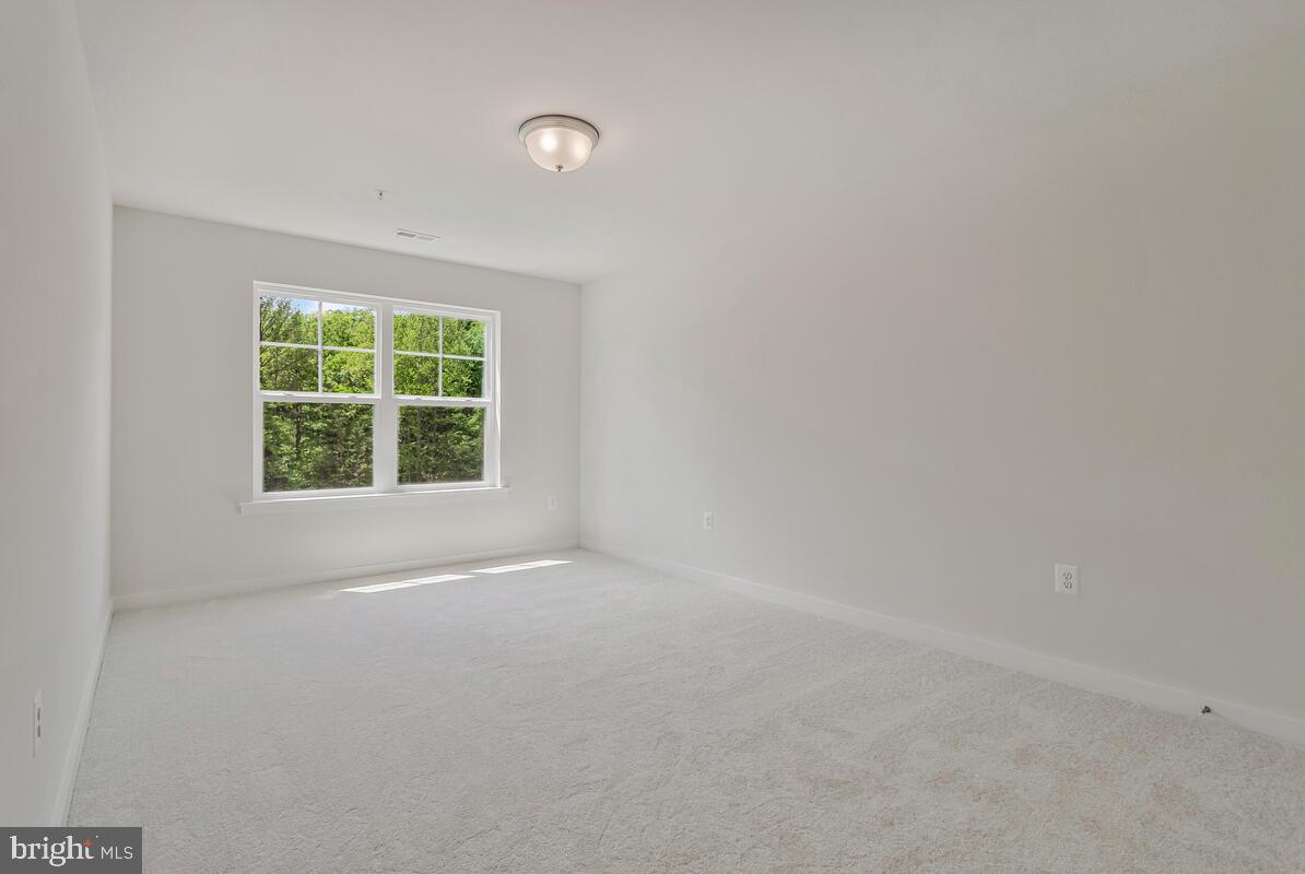 1302 Spruce Street Shady Side, MD 20764 - Photo 32 of 43 an empty room with a window