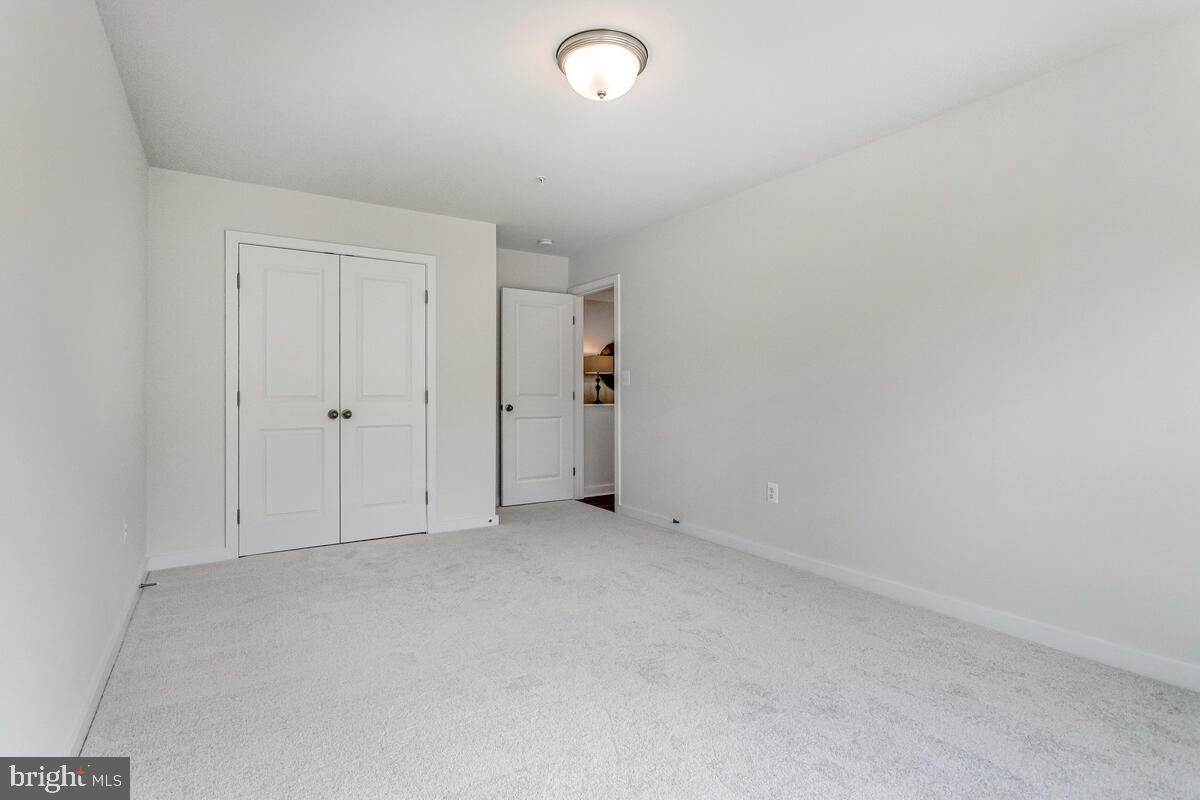 1302 Spruce Street Shady Side, MD 20764 - Photo 34 of 44 an empty room with an entryway