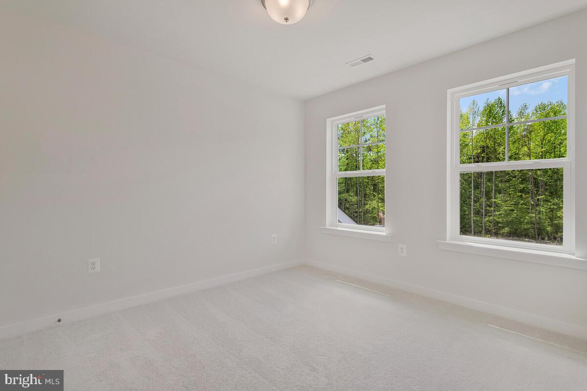 1302 Spruce Street Shady Side, MD 20764 - Photo 34 of 43 an empty room with windows