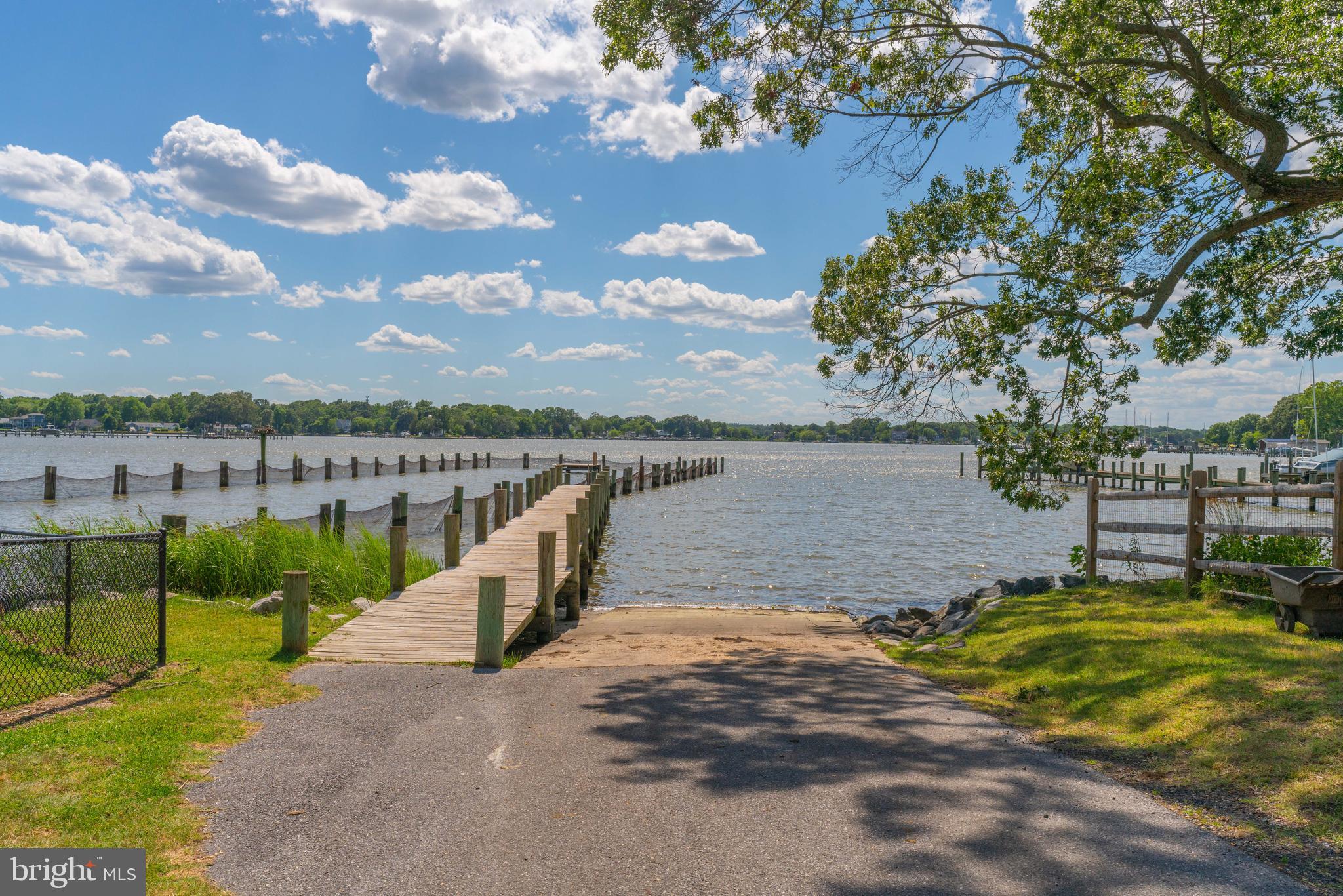 1302 Spruce Street Shady Side, MD 20764 - Photo 44 of 44 a view of a lake with houses in the back