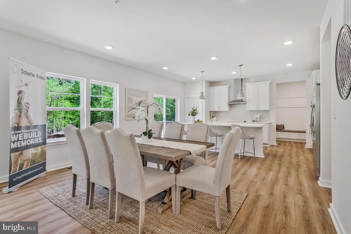 1302 Spruce Street Shady Side, MD 20764 - Photo 10 of 44 a view of a dining room with furniture and wooden floor