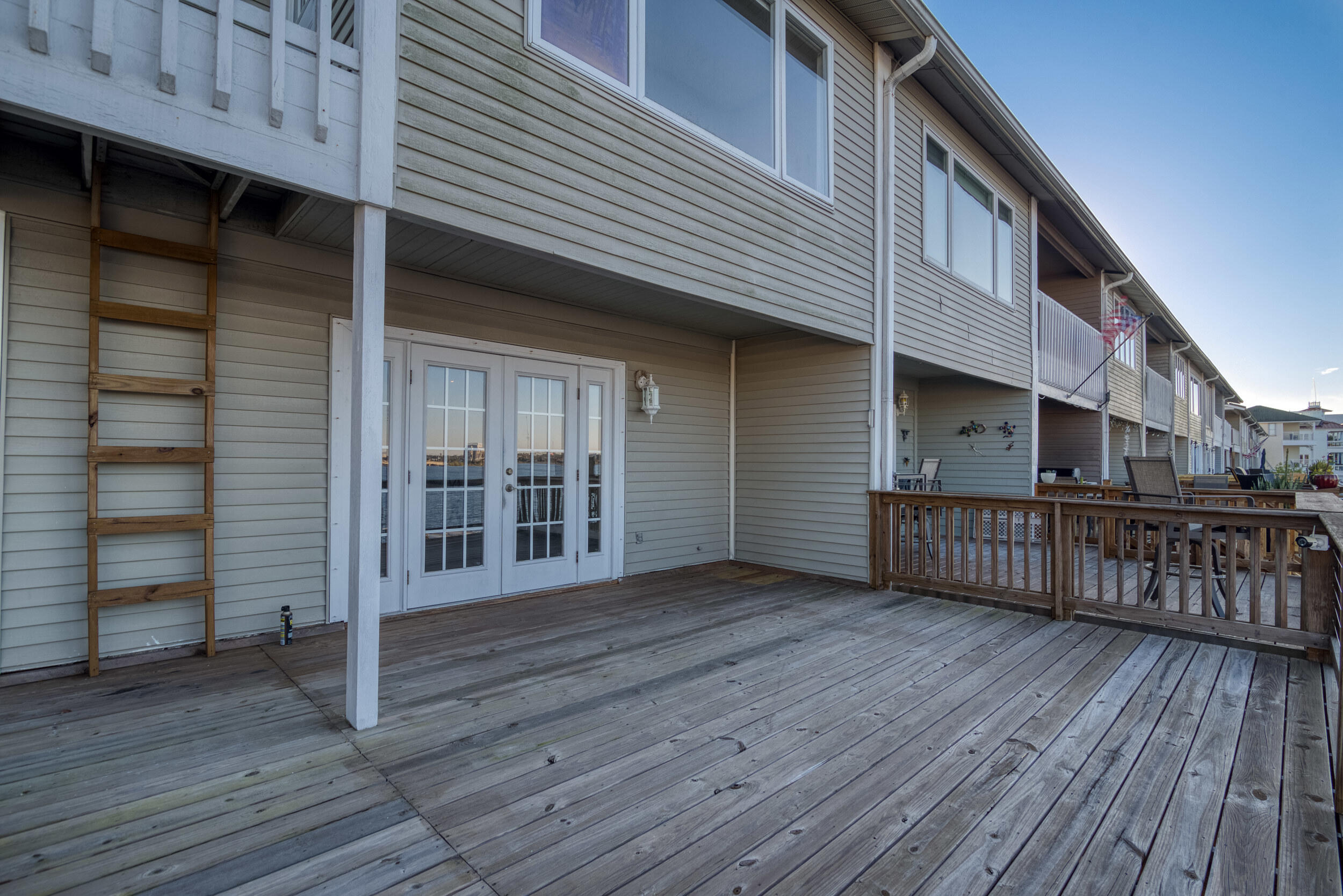 202 Snug Harbour Drive, Unit 202 Shalimar, FL 32579 - Photo 11 of 65 a view of a house with wooden deck