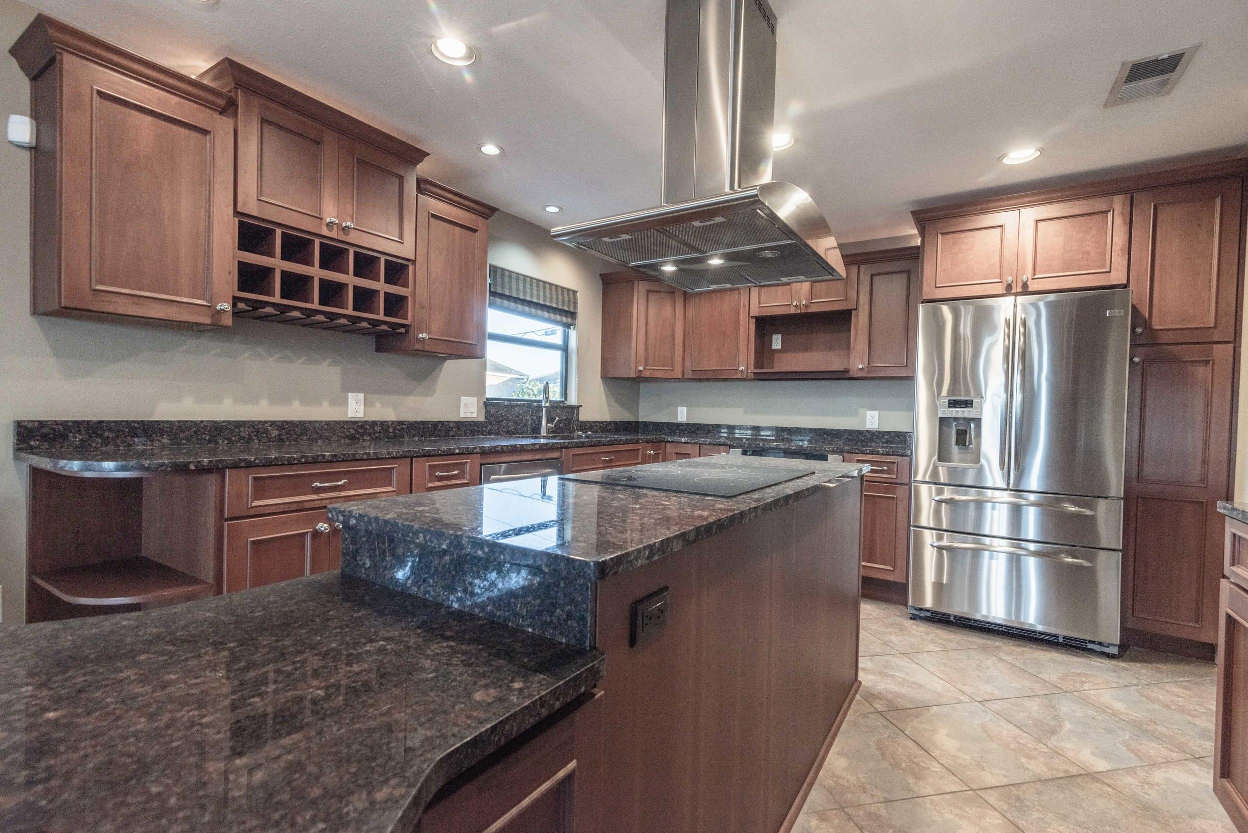 202 Snug Harbour Drive, Unit 202 Shalimar, FL 32579 - Photo 20 of 65 a kitchen with stainless steel appliances granite countertop a sink stove and refrigerator