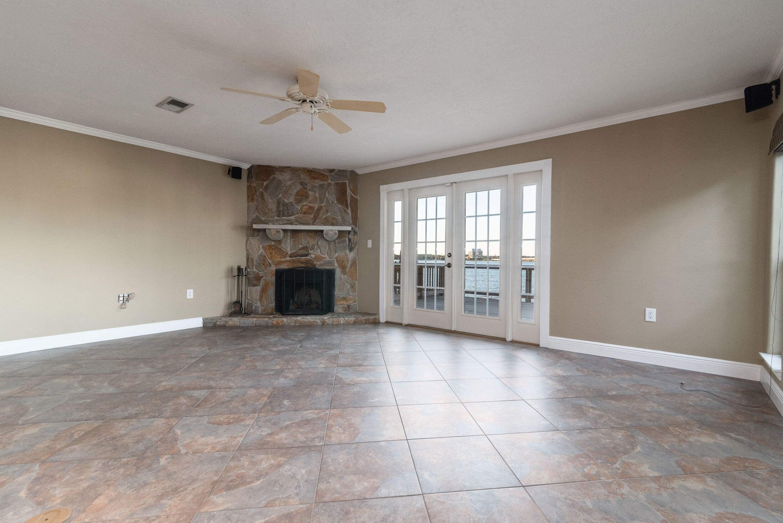 202 Snug Harbour Drive, Unit 202 Shalimar, FL 32579 - Photo 26 of 65 a view of an empty room with a fireplace and a window