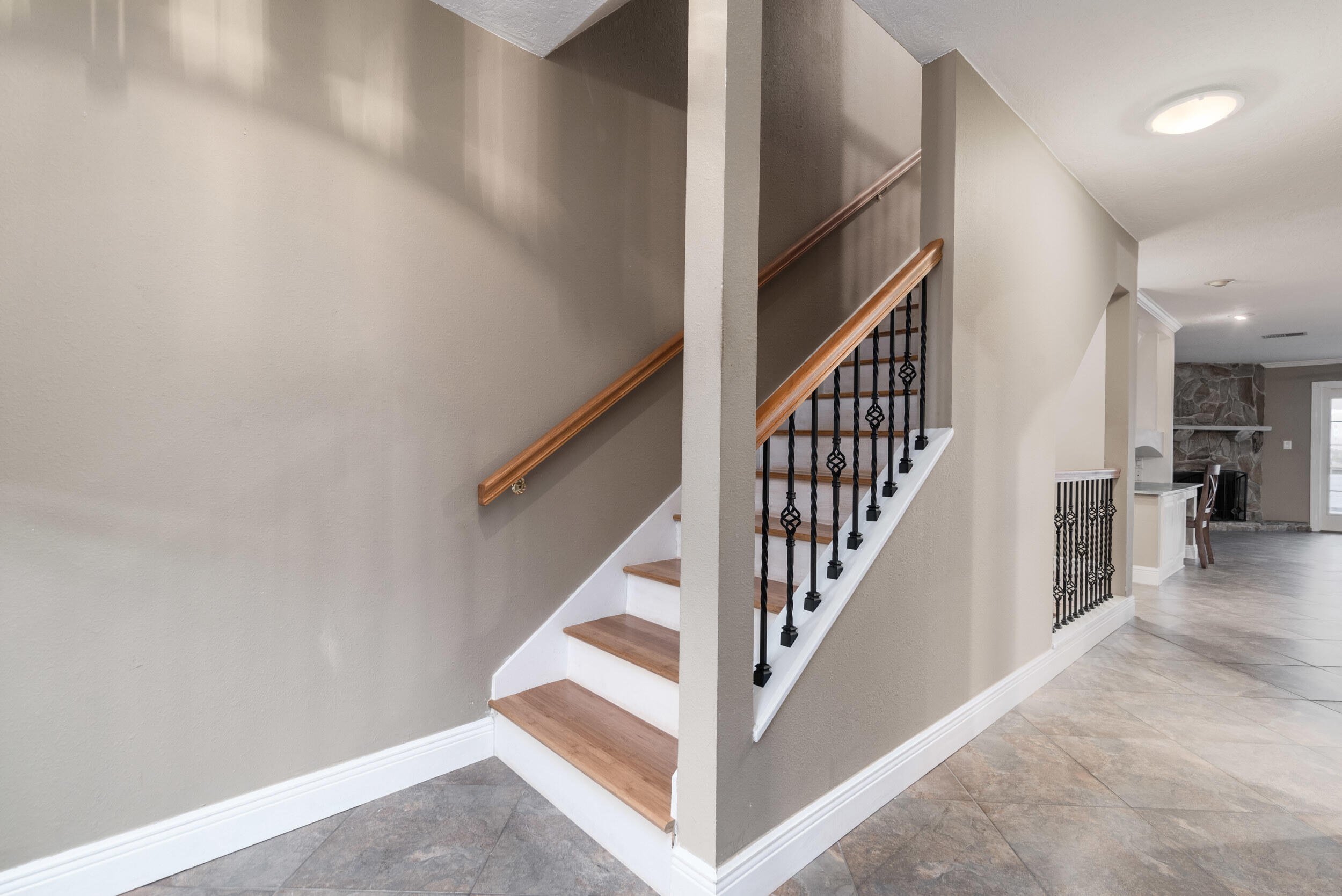202 Snug Harbour Drive, Unit 202 Shalimar, FL 32579 - Photo 33 of 65 a view of staircase with lots of frames on wall and a window