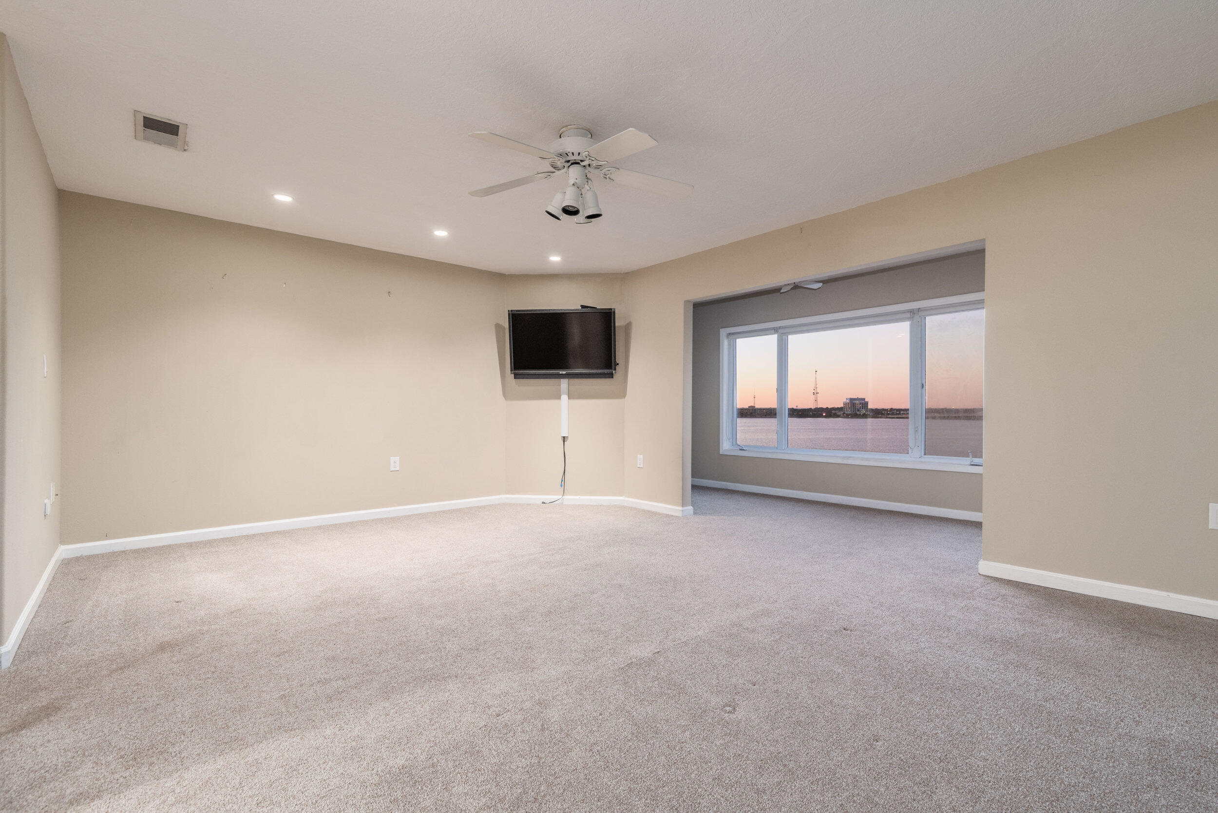 202 Snug Harbour Drive, Unit 202 Shalimar, FL 32579 - Photo 44 of 65 a view of an empty room with a window and a kitchen