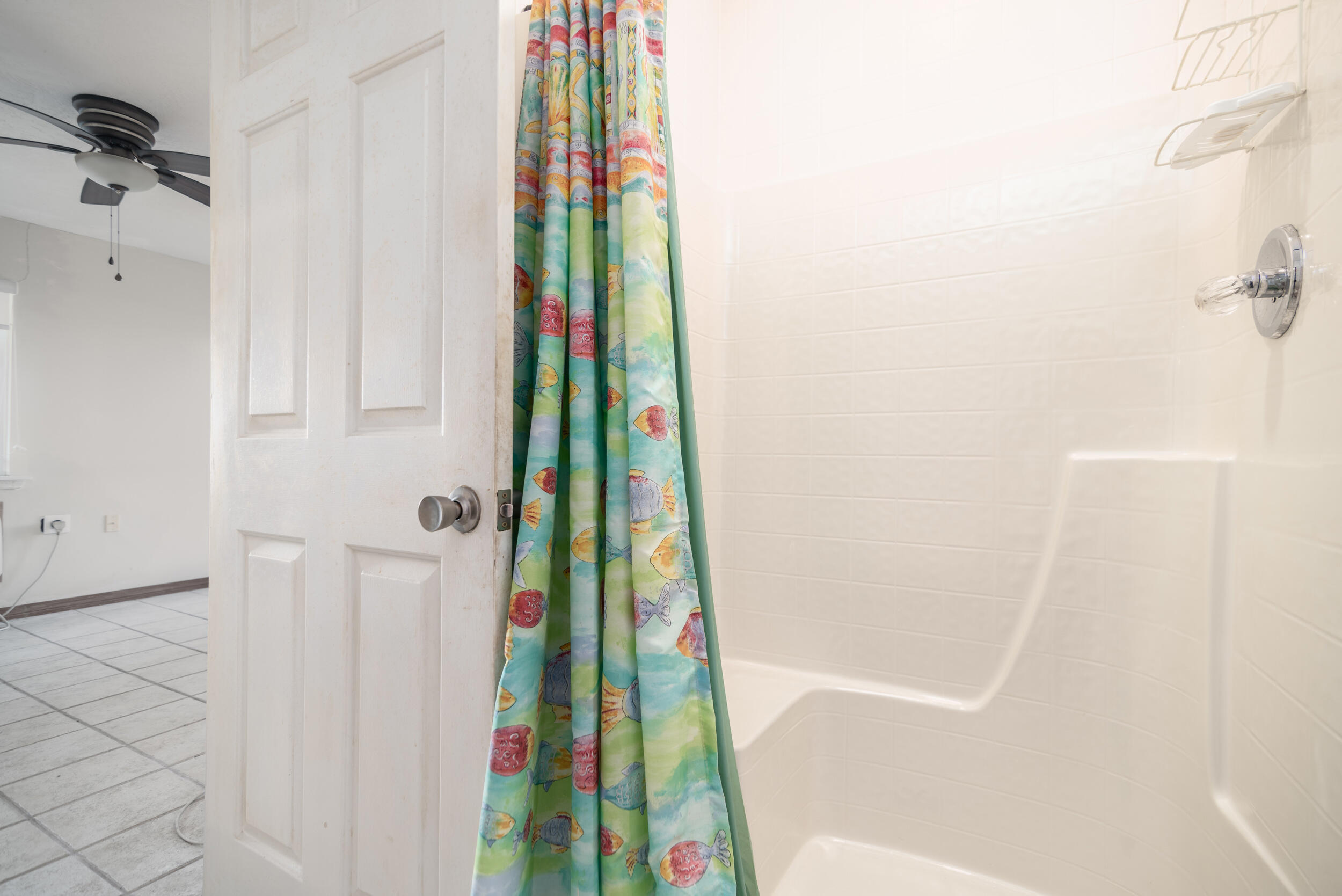 202 Snug Harbour Drive, Unit 202 Shalimar, FL 32579 - Photo 56 of 65 a bathroom with a bathtub and a shower