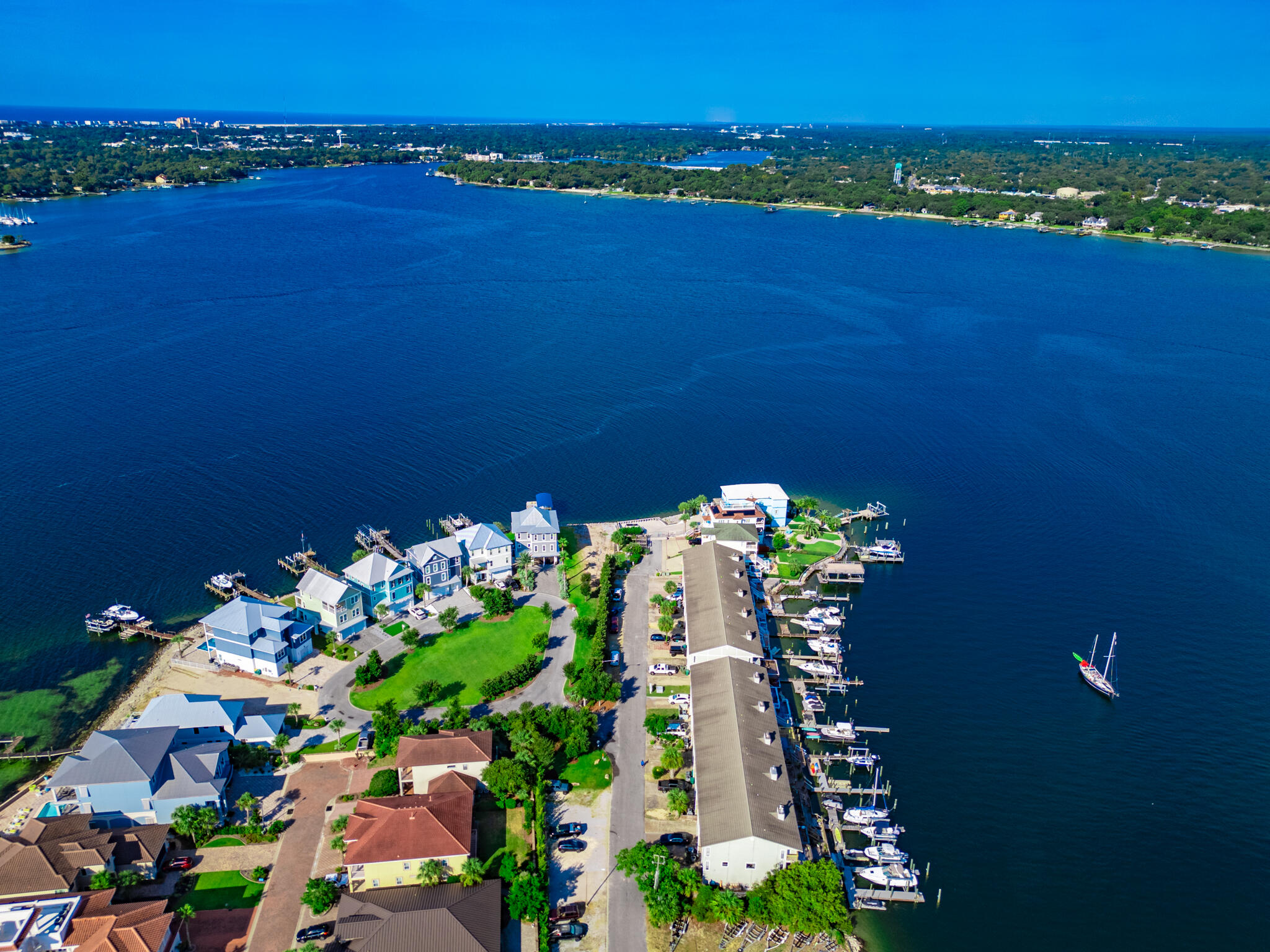 202 Snug Harbour Drive, Unit 202 Shalimar, FL 32579 - Photo 62 of 65 a view of a lake with a city