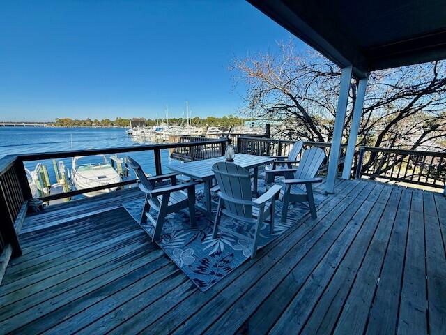 202 Snug Harbour Drive, Unit 202 Shalimar, FL 32579 - Photo 65 of 65 a view of a chairs and table on the wooden roof deck