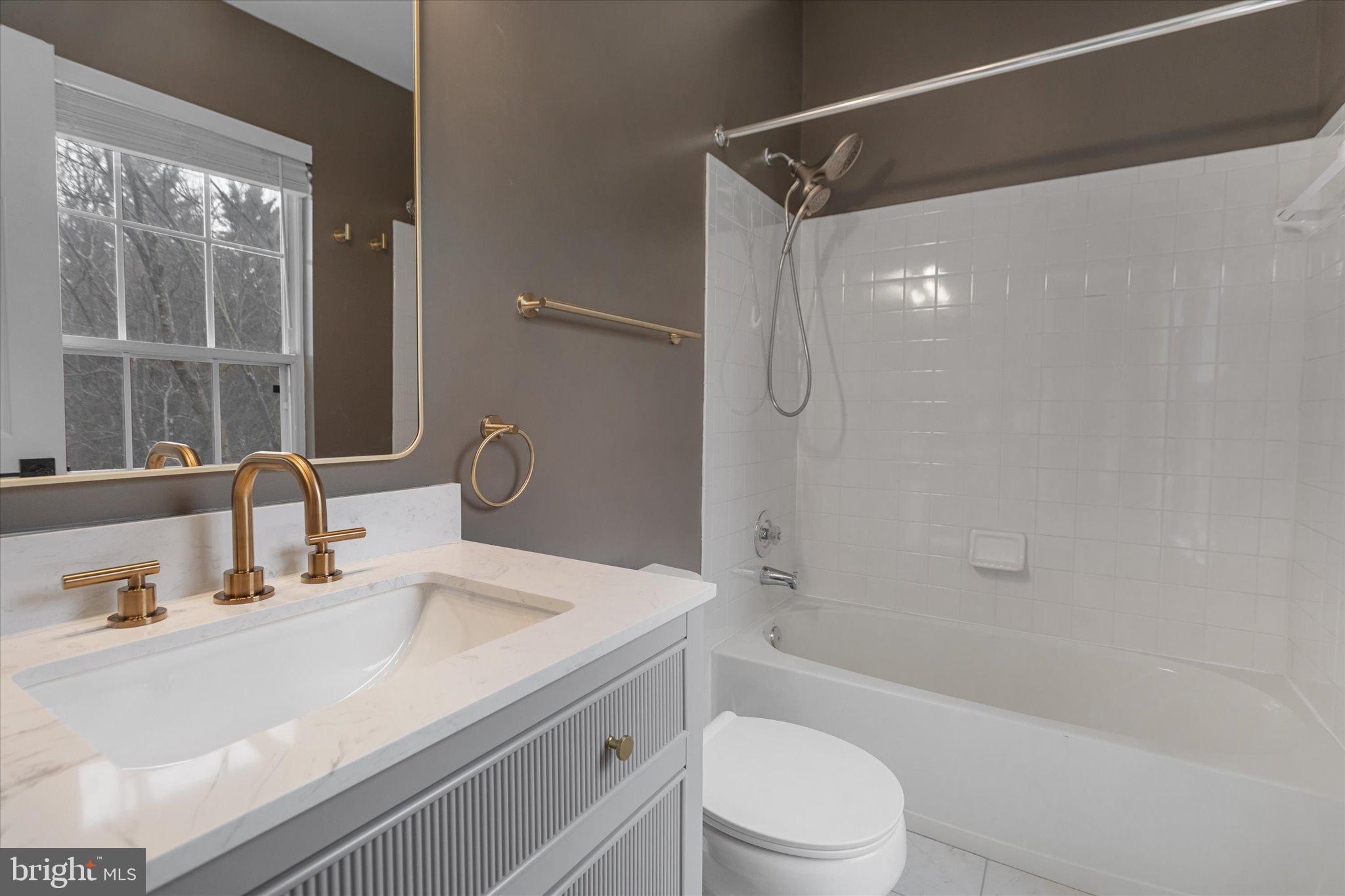 6105 Starburn Path Columbia, MD 21045 - Photo 15 of 30 a bathroom with a sink a toilet and shower