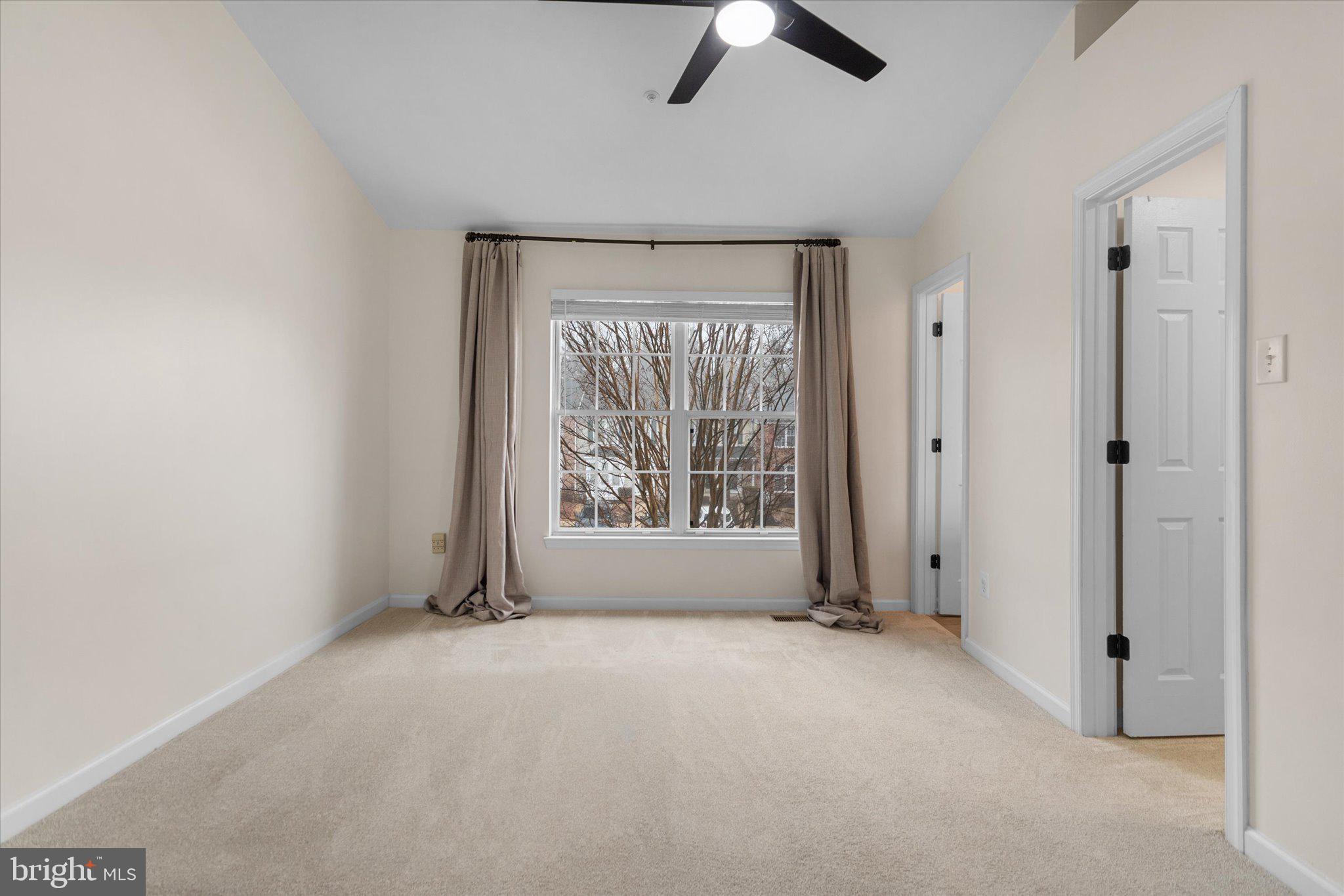 6105 Starburn Path Columbia, MD 21045 - Photo 17 of 30 an empty room with windows and closet