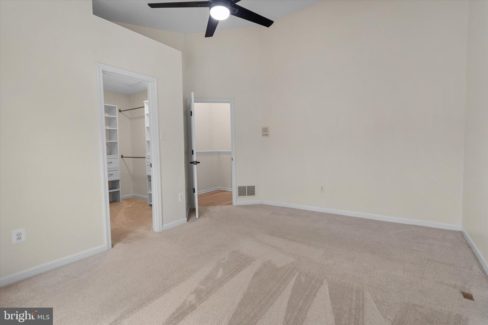 6105 Starburn Path Columbia, MD 21045 - Photo 18 of 30 an empty room with closet and windows
