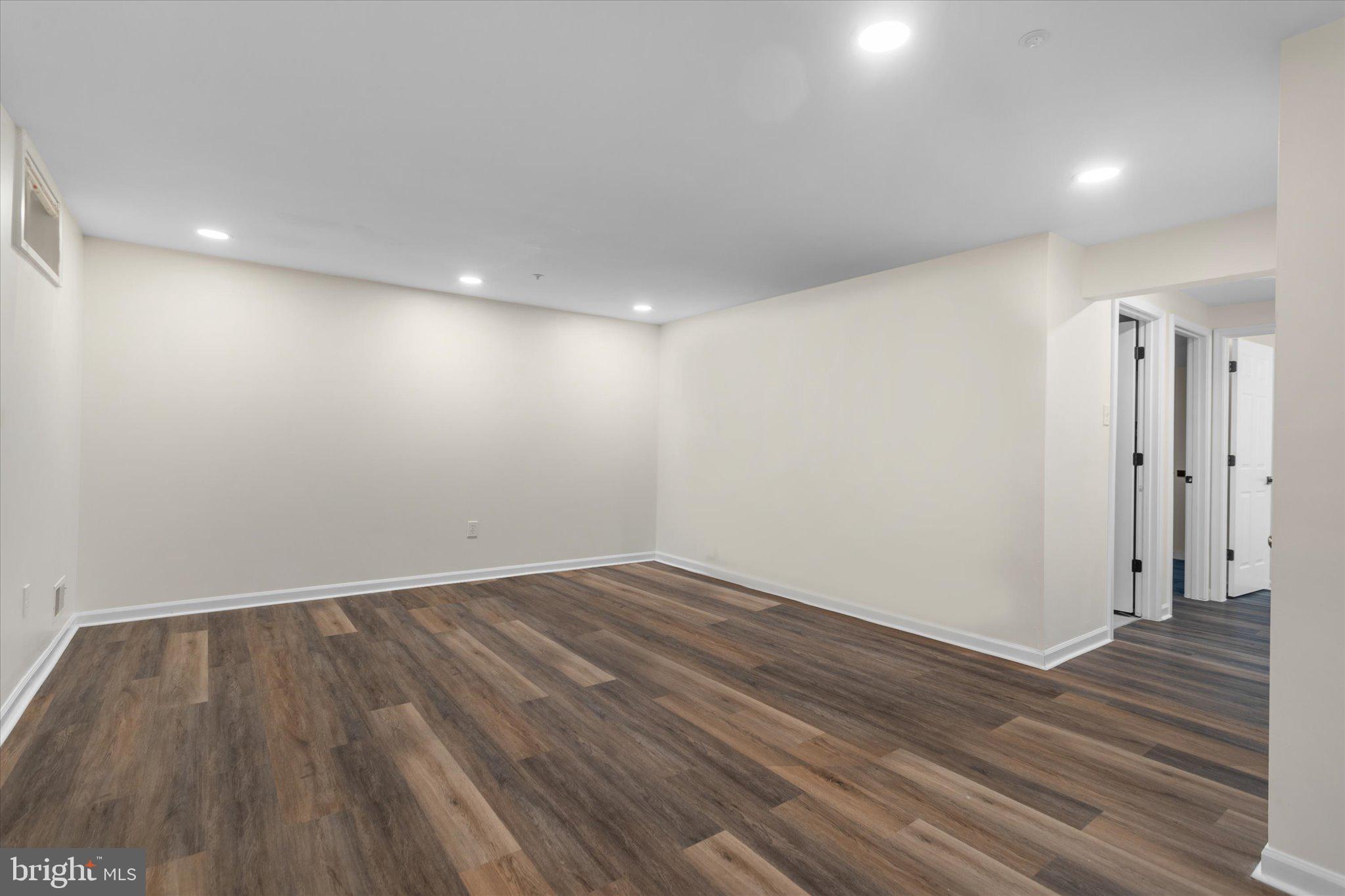 6105 Starburn Path Columbia, MD 21045 - Photo 21 of 30 a view of empty room with wooden floor