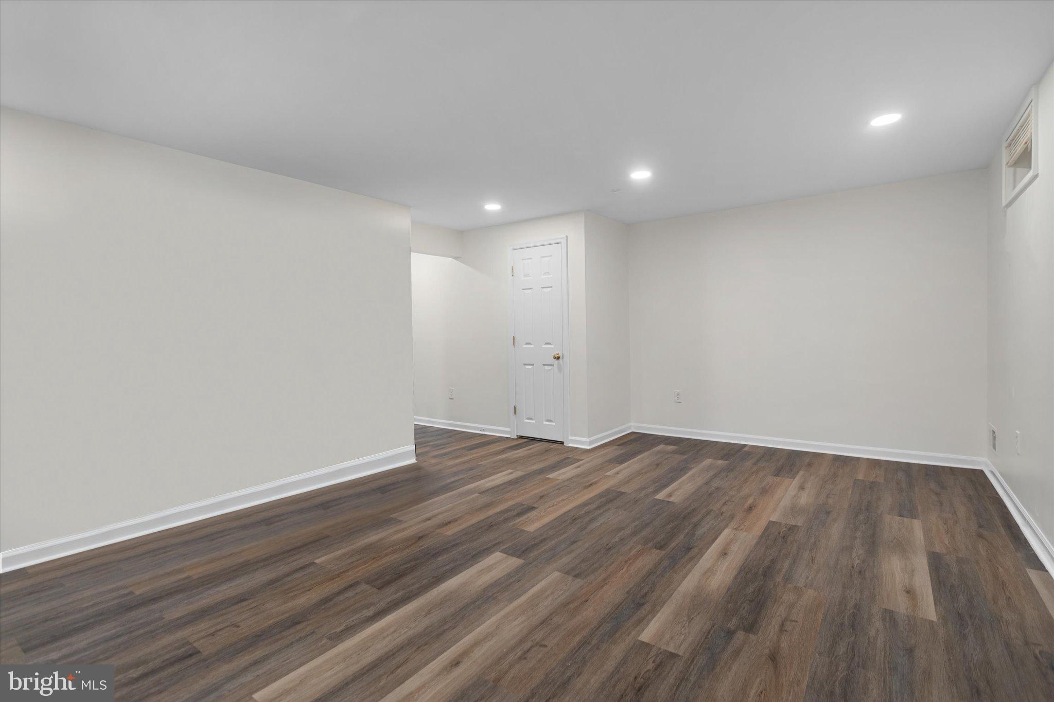6105 Starburn Path Columbia, MD 21045 - Photo 22 of 30 a view of an empty room with wooden floor