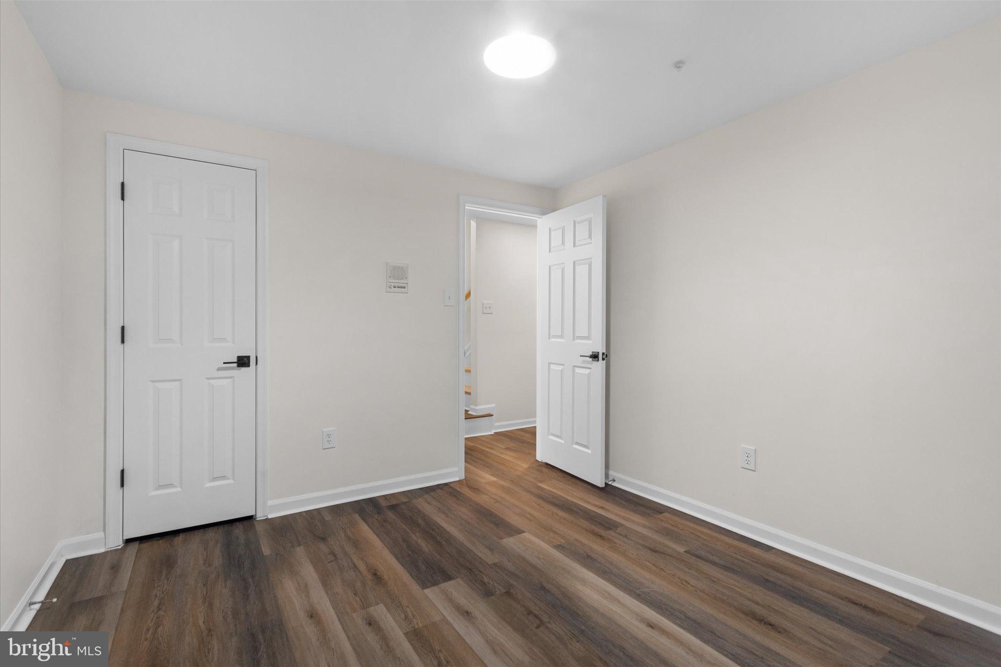 6105 Starburn Path Columbia, MD 21045 - Photo 24 of 30 a view of an empty room and wooden floor