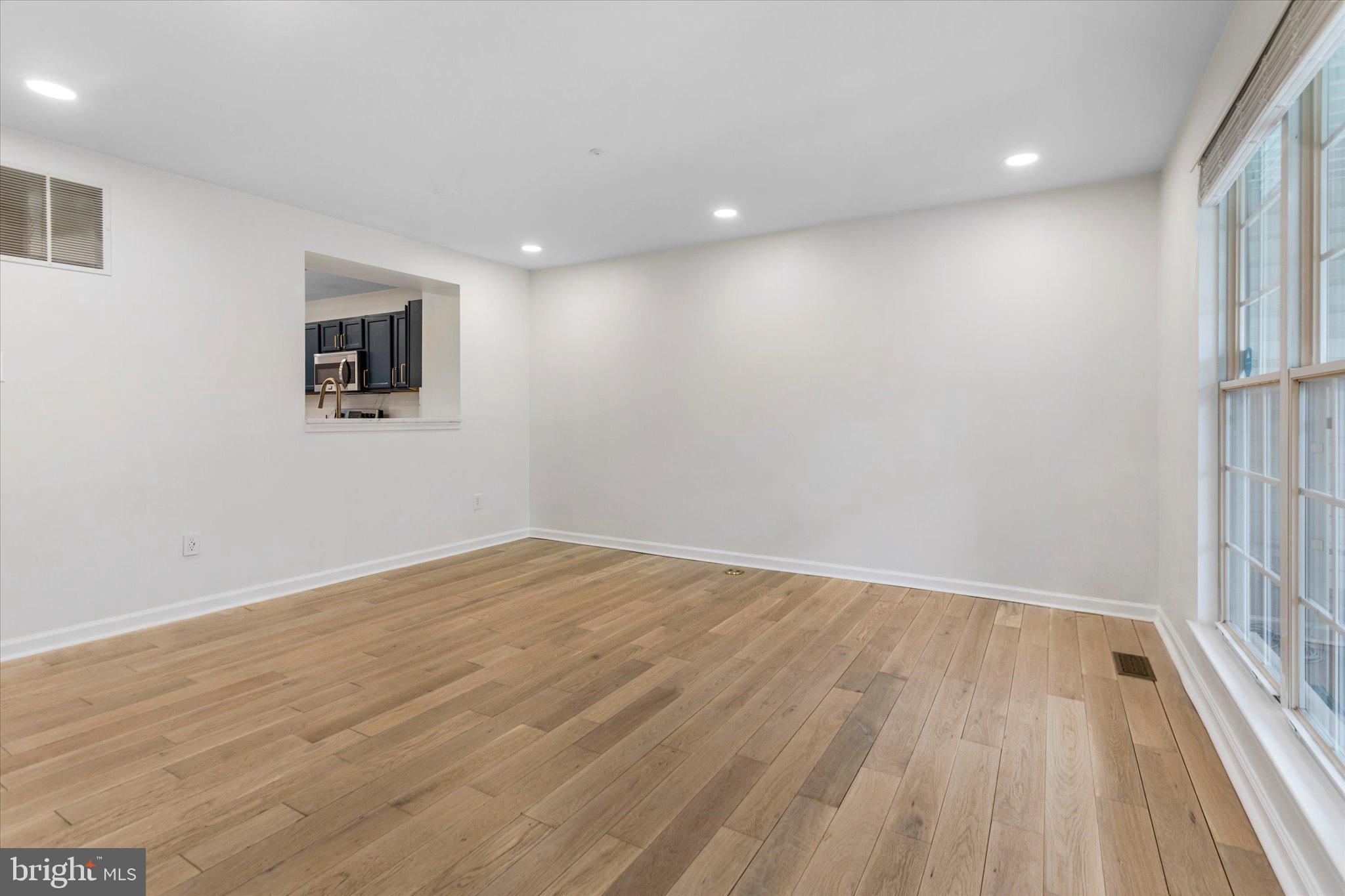 6105 Starburn Path Columbia, MD 21045 - Photo 5 of 30 a view of empty room with wooden floor and fan