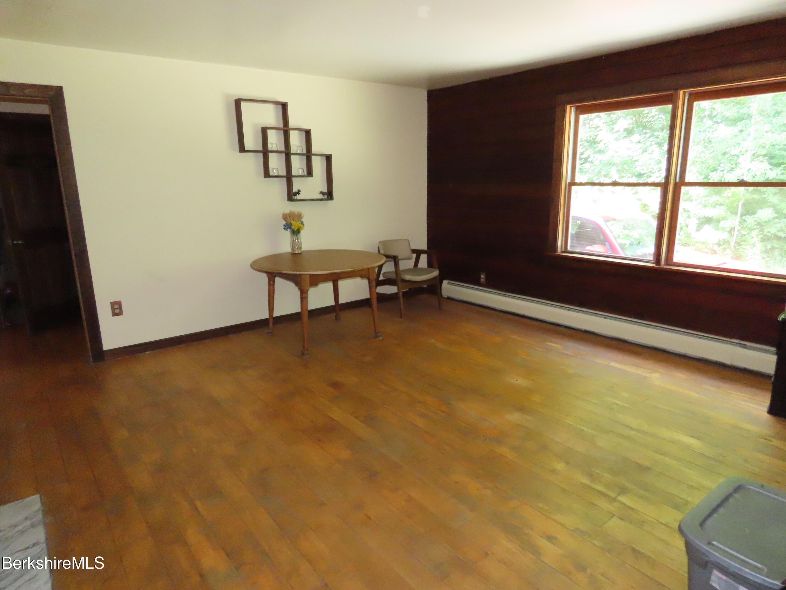 460 Sparrow Drive Stamford, VT 05352 - Photo 12 of 79 a view of a room with gym equipment and a large window