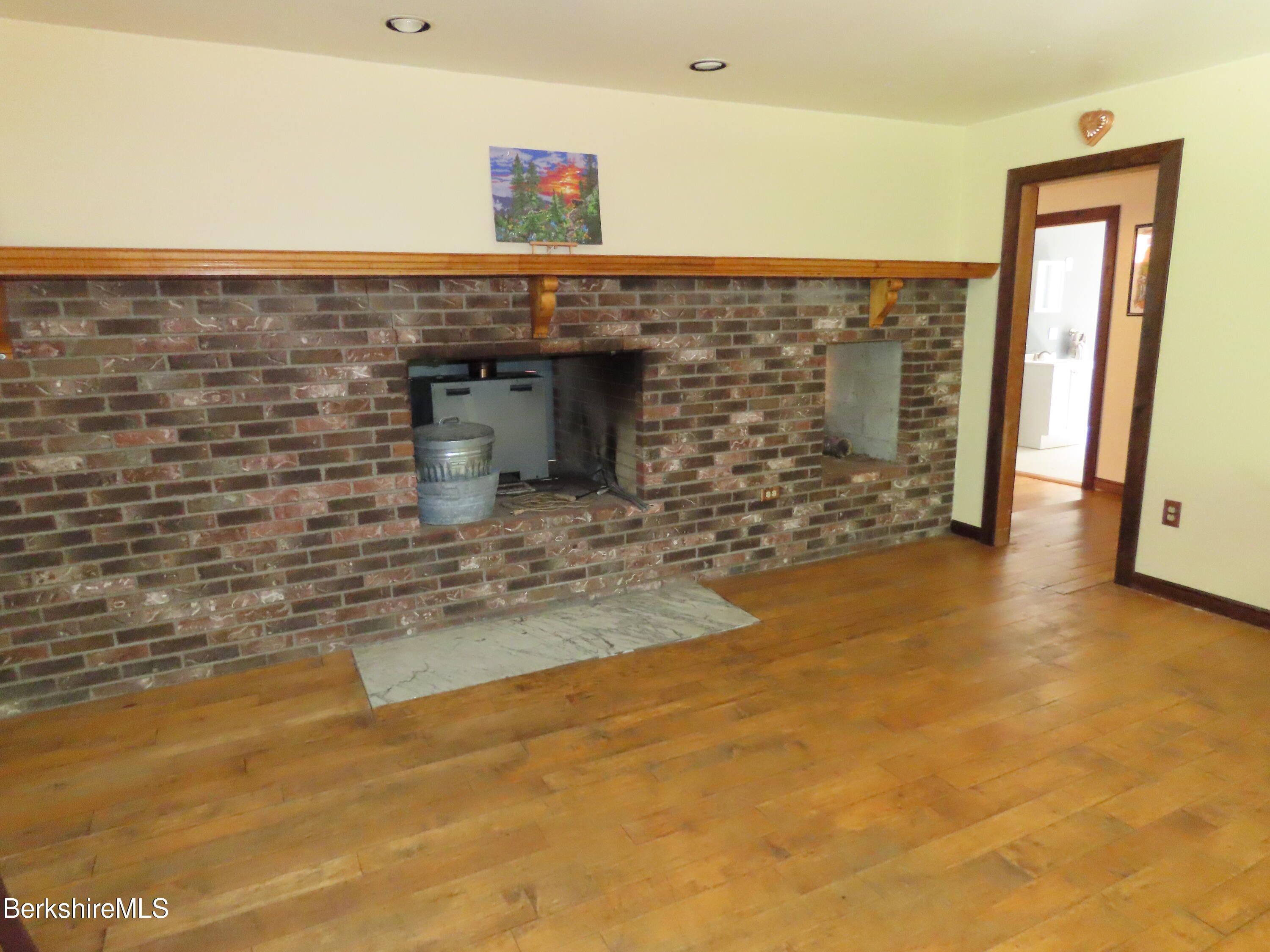 460 Sparrow Drive Stamford, VT 05352 - Photo 13 of 79 Dining room fireplace