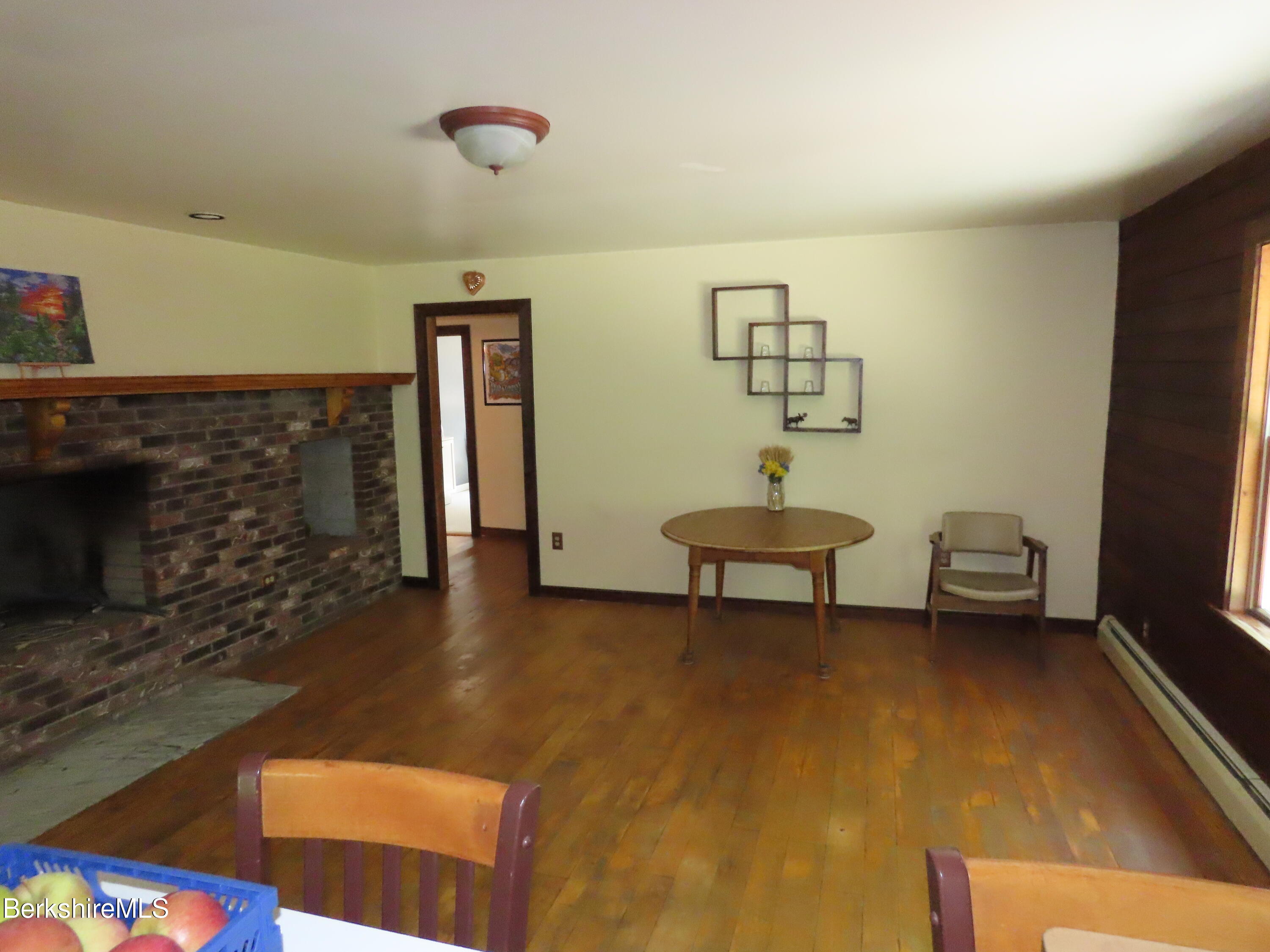 460 Sparrow Drive Stamford, VT 05352 - Photo 14 of 79 a living room with furniture and a fireplace