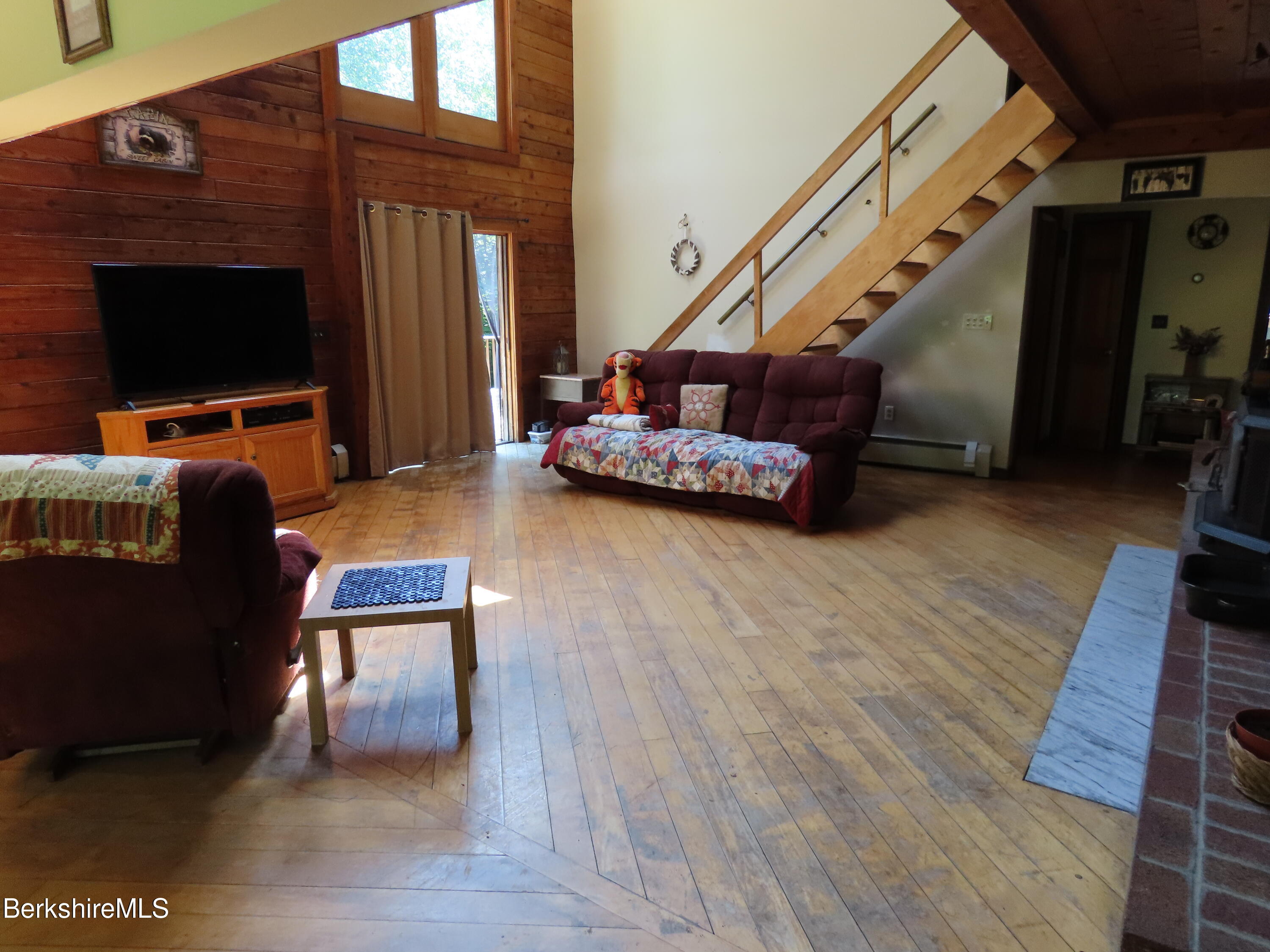 460 Sparrow Drive Stamford, VT 05352 - Photo 16 of 79 a living room with furniture and a flat screen tv