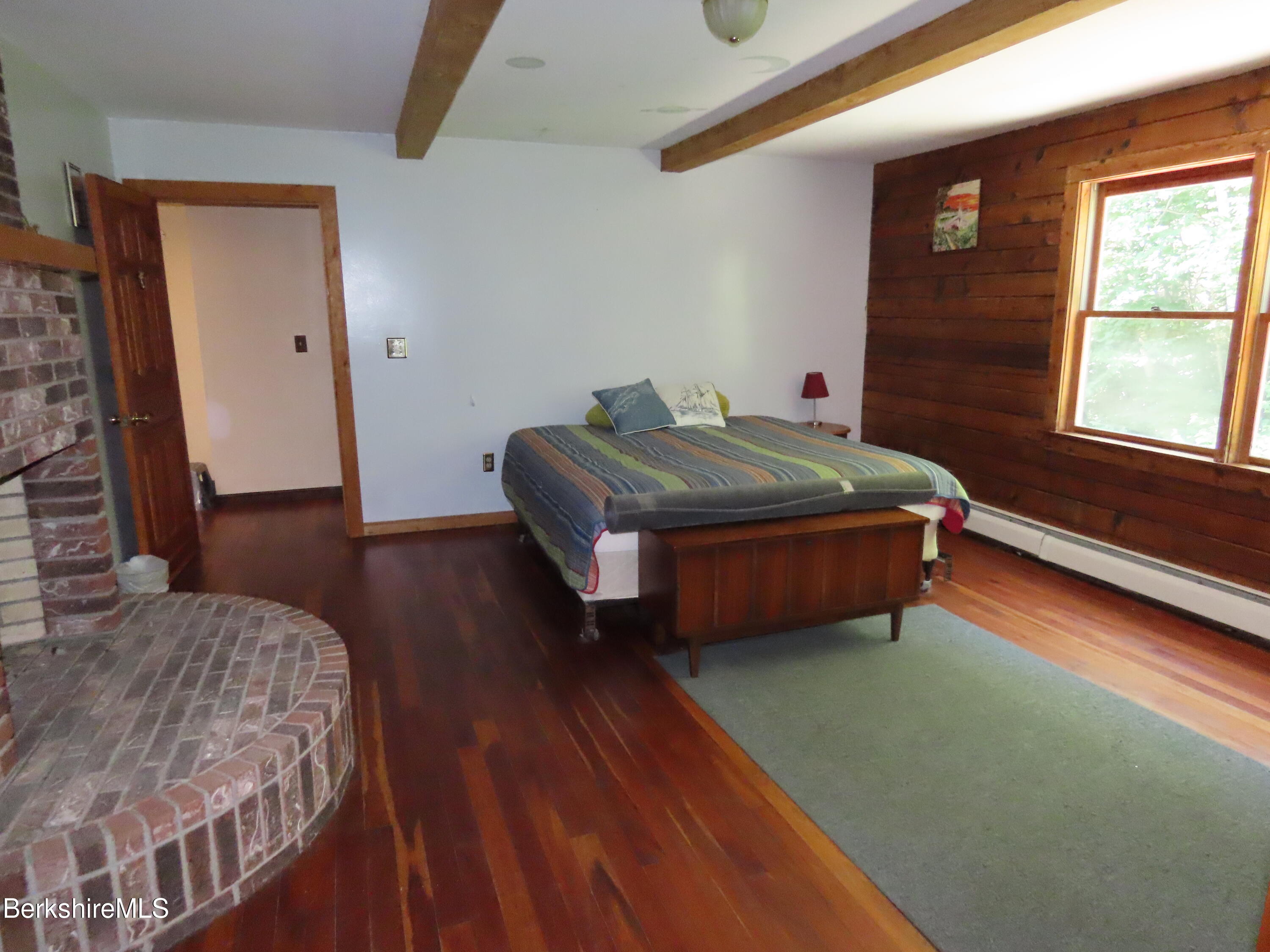460 Sparrow Drive Stamford, VT 05352 - Photo 34 of 79 a bedroom with a bed and wooden floor