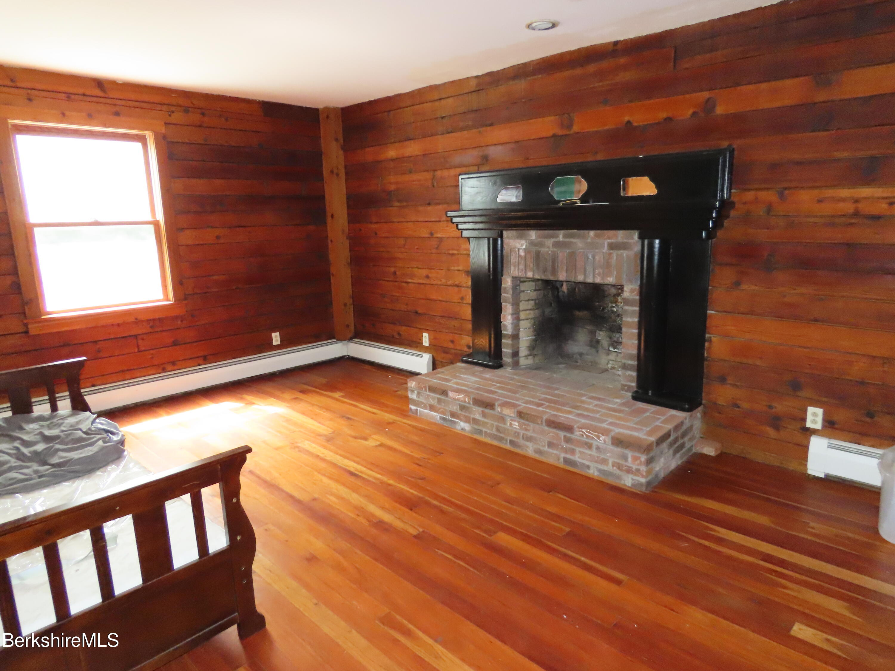 460 Sparrow Drive Stamford, VT 05352 - Photo 52 of 79 a view of a fireplace in a room