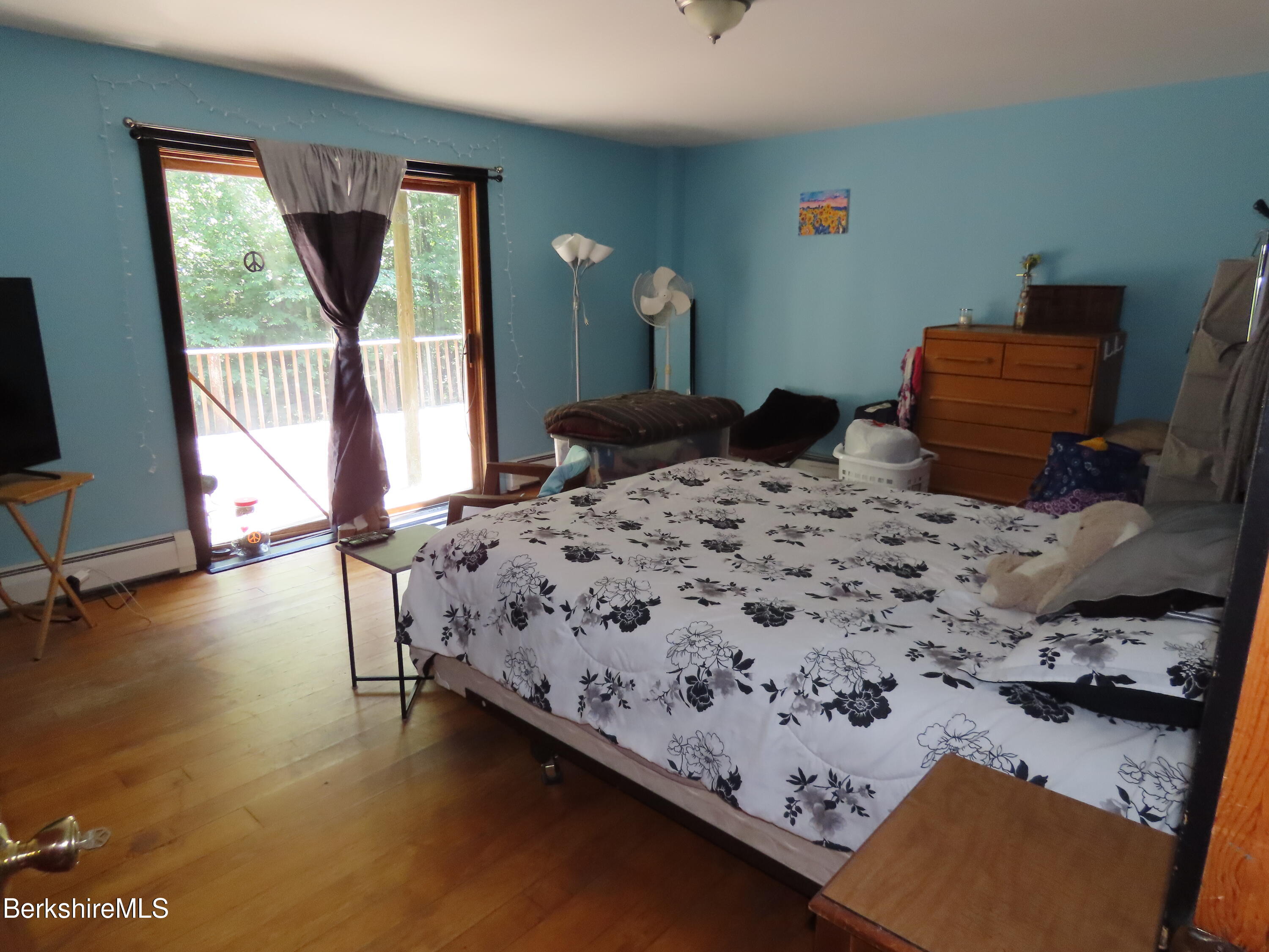 460 Sparrow Drive Stamford, VT 05352 - Photo 56 of 79 a bedroom with a bed and wooden floor
