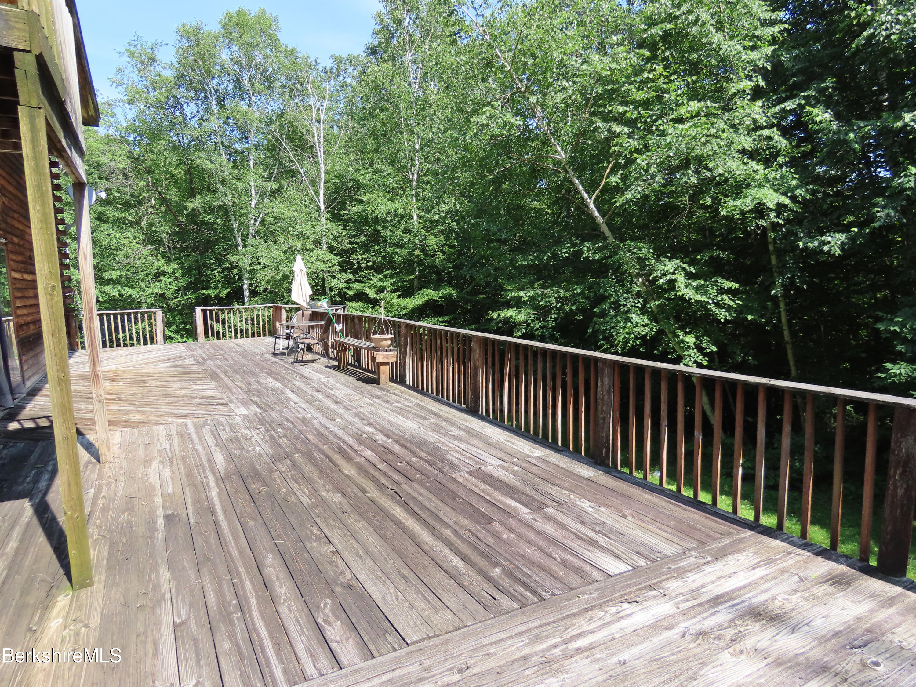 460 Sparrow Drive Stamford, VT 05352 - Photo 62 of 79 a view of backyard with deck and outdoor seating