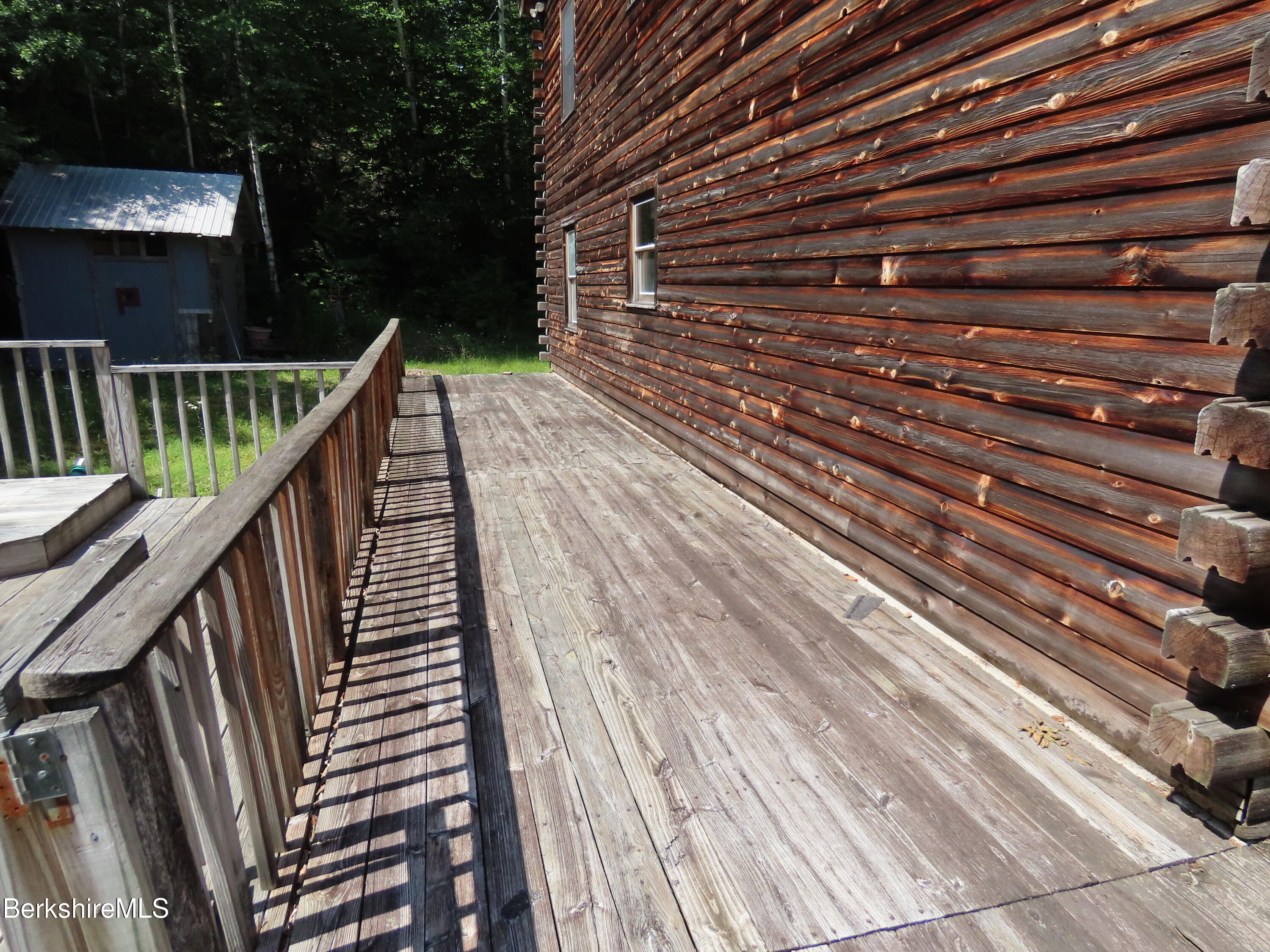 460 Sparrow Drive Stamford, VT 05352 - Photo 63 of 79 a balcony with wooden floor and fence