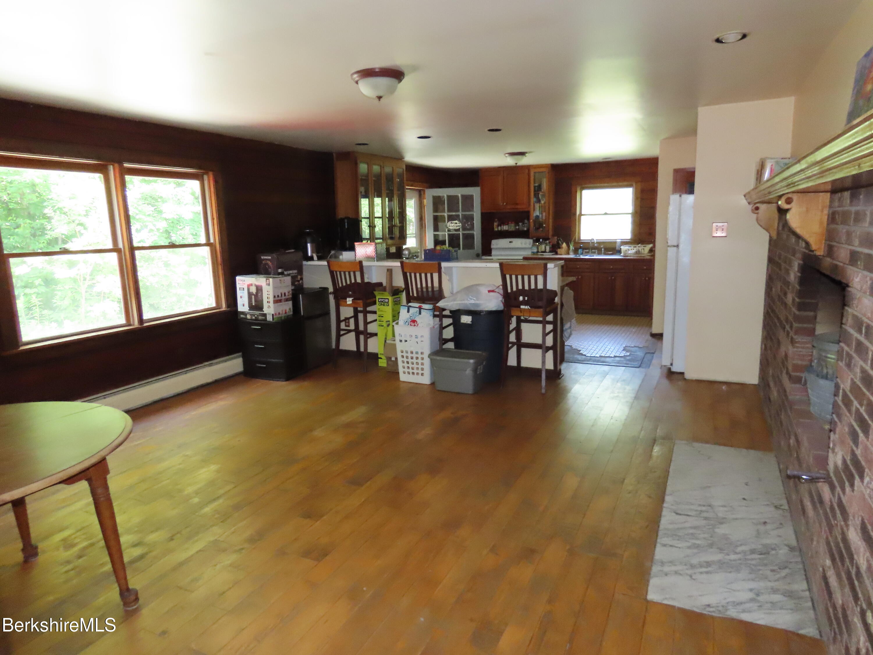 460 Sparrow Drive Stamford, VT 05352 - Photo 10 of 79 a living room with fireplace furniture and a large window