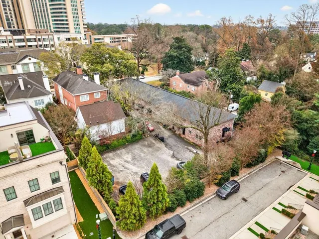 an aerial view of residential houses with outdoor space