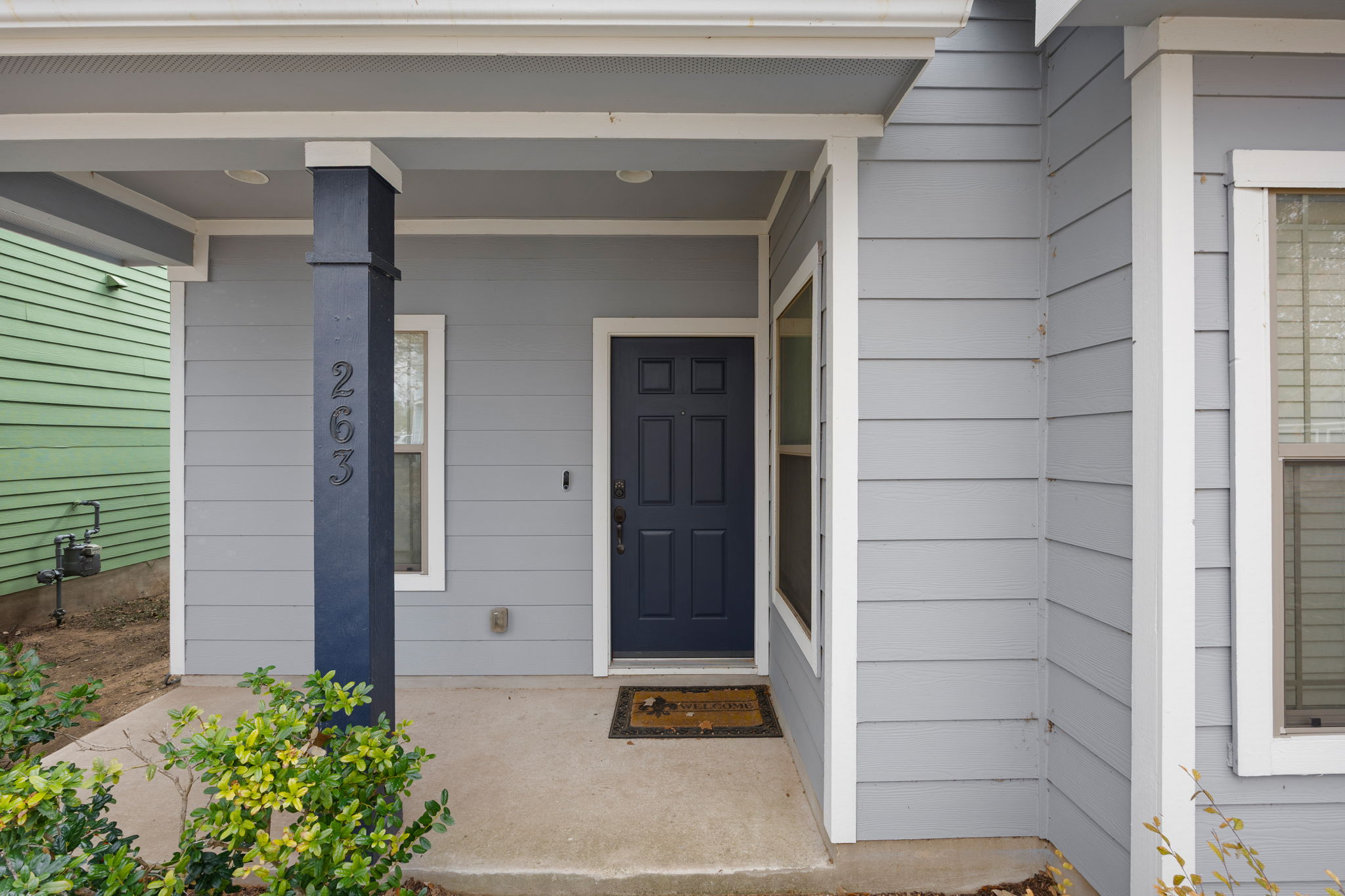 263 Cleveland Kyle, TX 78640 - Photo 2 of 20 Doorway to property featuring a porch