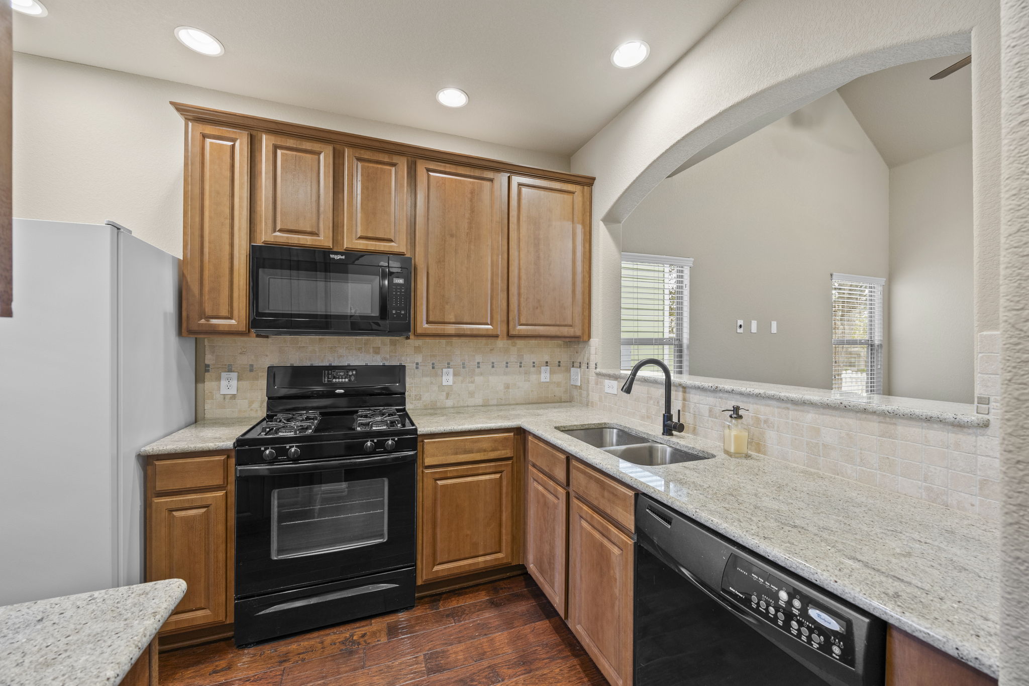 263 Cleveland Kyle, TX 78640 - Photo 7 of 20 Kitchen over looking the living room.