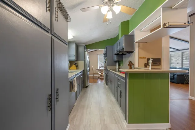 a kitchen with a sink and wooden cabinets