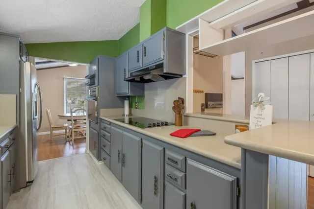 a view of a hallway with washer and dryer