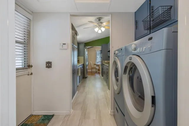 a view of a storage & utility room with a window