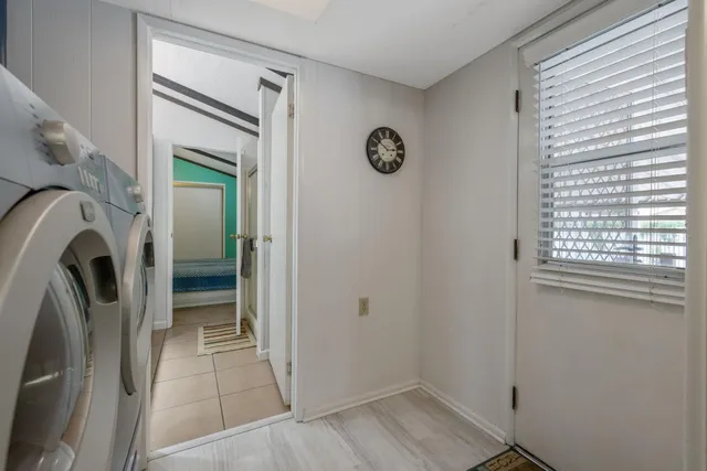a bathroom with a sink a large mirror and a shower