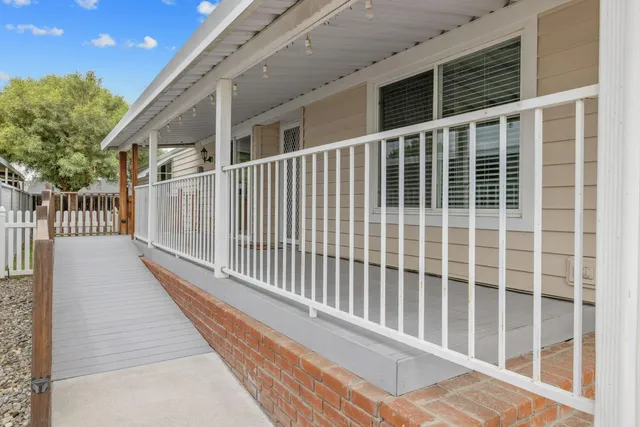 a view of balcony with wooden floor