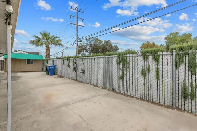 a view of a backyard with a tree
