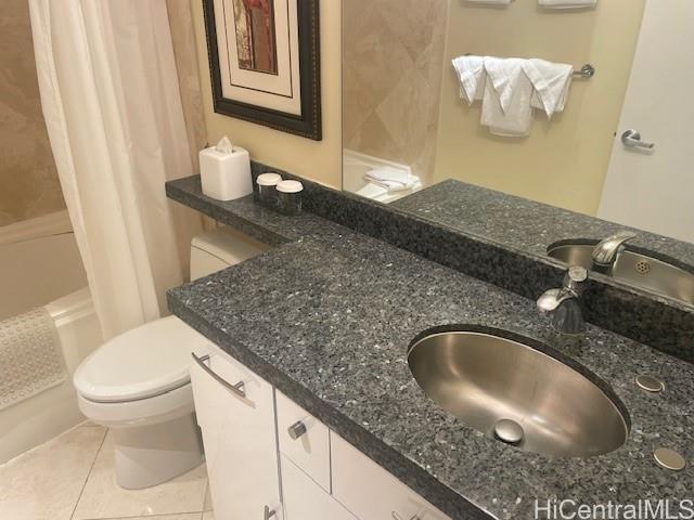 1088 Bishop Street, Unit 3606 Honolulu, HI 96813 - Photo 14 of 19 a bathroom with a granite countertop sink and a toilet